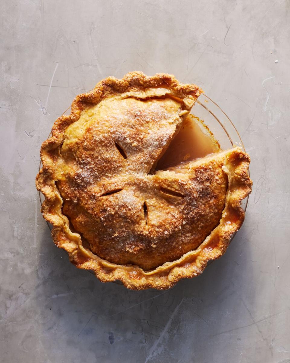 best apple pie sliced on gray countertop