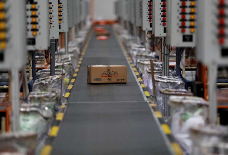 FILE PHOTO: A package for delivery is seen on a conveyor belt at online retailer Lazada's warehouse in Depok