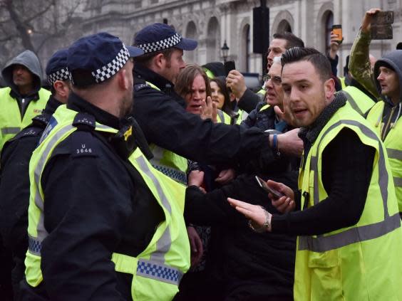 Yellow vests scuffle with police in Whitehall on Saturday (Rex)