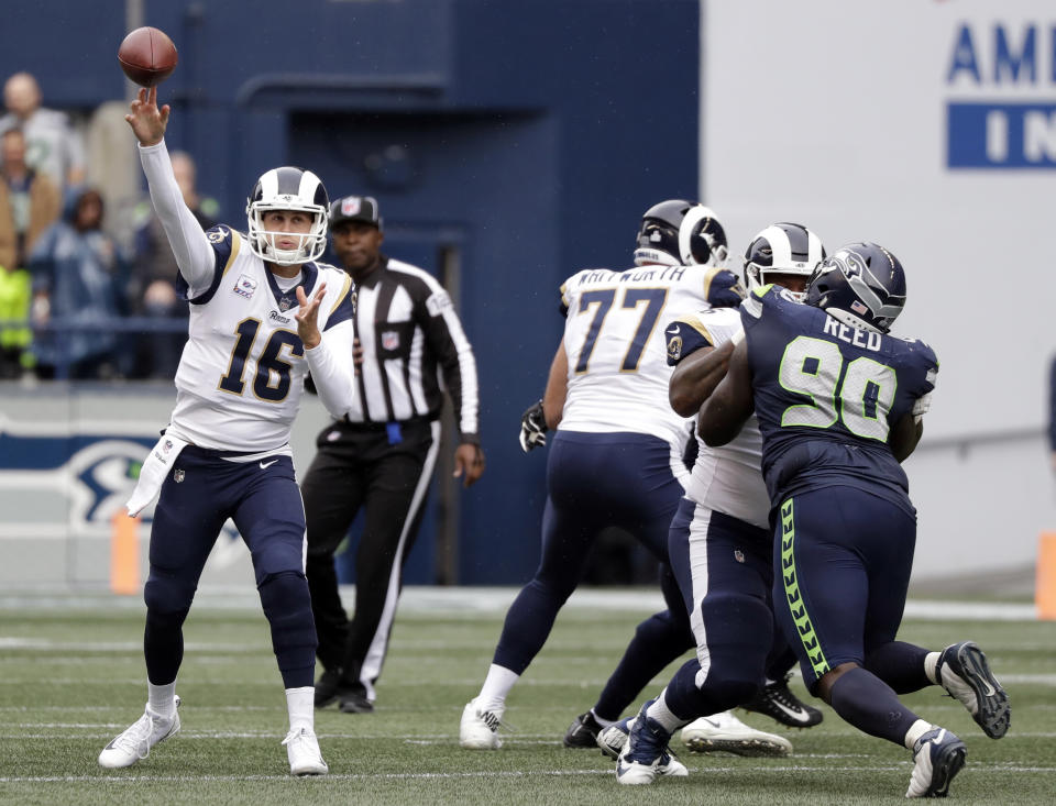 Los Angeles Rams quarterback Jared Goff (16) passes against the Seattle Seahawks during the first half of an NFL football game, Sunday, Oct. 7, 2018, in Seattle. (AP Photo/Elaine Thompson)