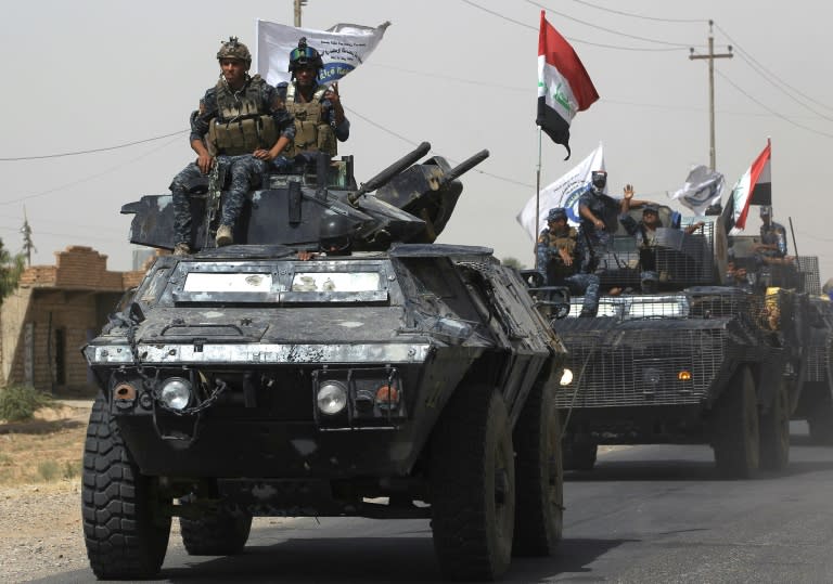 Iraqi forces advance towards Hawija on September 23, 2017 after retaking the nearby northern town of Sharqat from the Islamic State group