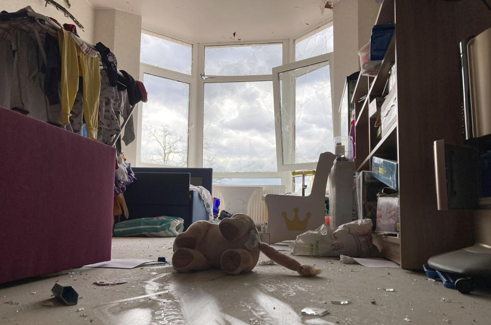 A stuffed toy lies abandoned amid broken glass in a war-damaged apartment in Irpin, Ukraine, on Monday, April 11, 2022. Heartened by Russia’s withdrawal from the capital region, some residents have been coming to what’s left of home. (AP Photo/Cara Anna)