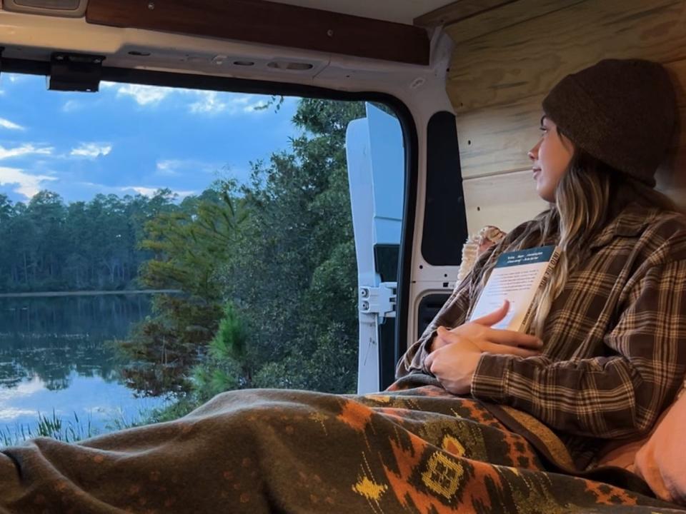 Sierra Fernald stares out the back of her van.