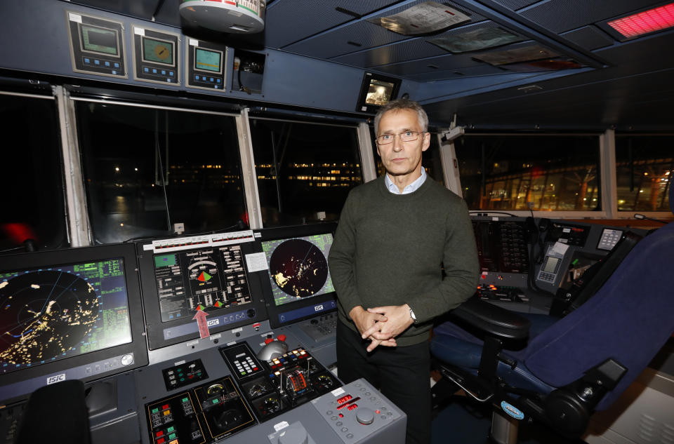NATO Secretary General, Jens Stoltenberg poses for a photo, on the bridge of the Danish support ship HDMS Esbern Snare during his visit to the NATO exercise, in Trondheim, Norway, Monday Oct. 29. 2018. (Gorm Kallestad / NTB scanpix via AP)
