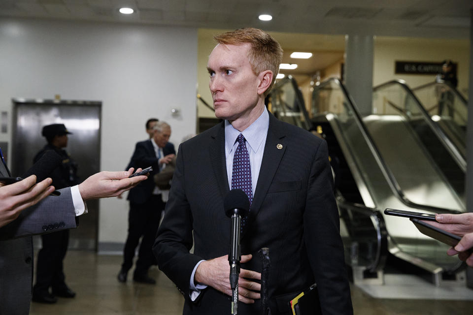 Sen. James Lankford, R-Okla., reacts to the final statement of House Democratic impeachment manager Rep. Adam Schiff, D-Calif., as he speaks to the media at the end of a day of an impeachment trial of President Donald Trump on charges of abuse of power and obstruction of Congress, Friday, Jan. 24, 2020, on Capitol Hill in Washington. (AP Photo/Jacquelyn Martin)