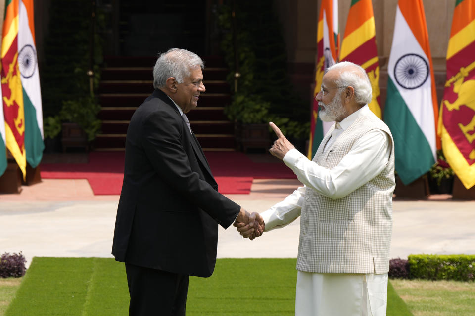 Indian Prime Minister Narendra Modi welcomes Sri Lankan President Ranil Wickremesinghe before their delegation level meeting in New Delhi, India, Friday, July 21, 2023. (AP Photo/Manish Swarup)