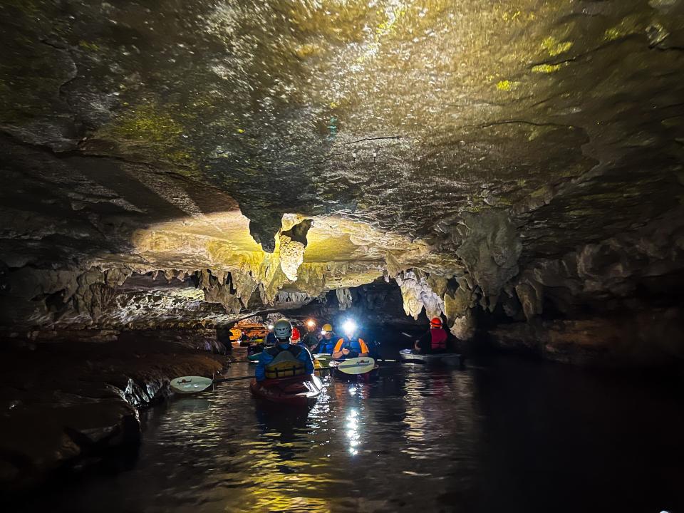 A guide leads the way about 1,000 feet into Sequiota Cave March 4, 2022.