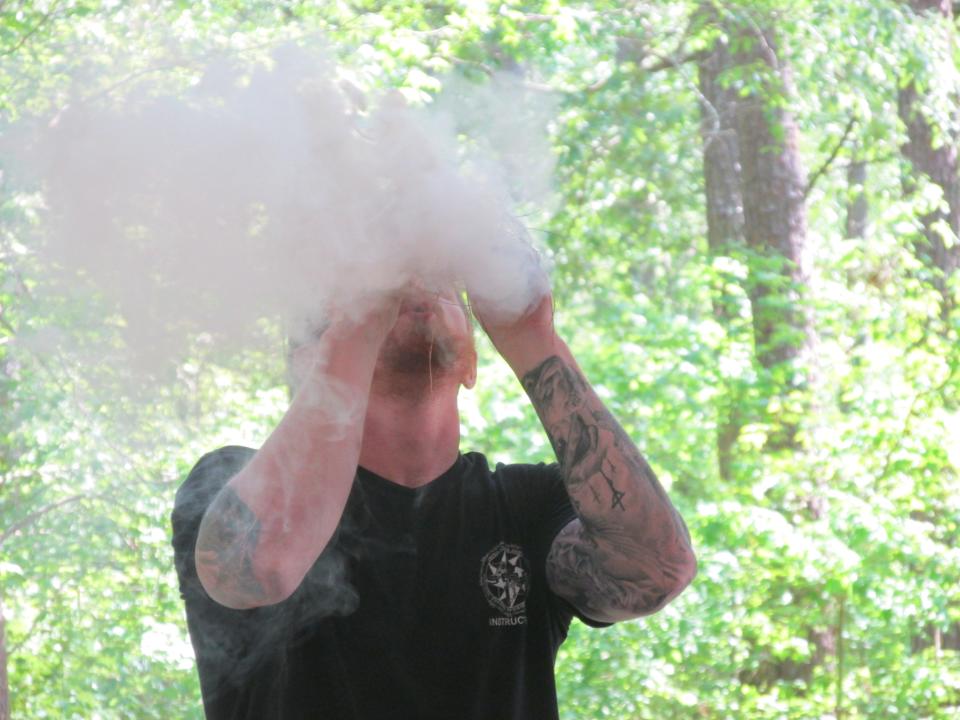 A Special Forces qualifications course instructor demonstrates how to use tinder for fire making as part of the Special Forces Spouses Qualifications Course on Wednesday, May 4, 2022, at Camp Mackall