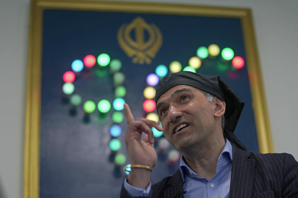 Gurch Randhawa speaks during an interview in the newly built Guru Nanak Gurdwara in Luton, England, Thursday, April 27, 2023. King Charles III visited the gurdwara last year as part of efforts to show that the monarchy, a 1,000-year-old institution with Christian roots, can still represent the people of modern, multi-cultural Britain. (AP Photo/Kin Cheung)