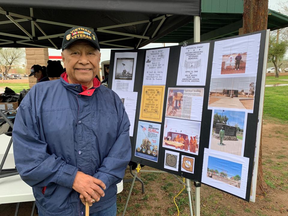 Lancelot Lewis stands next to a poster board outlining the creation of an Ira Hayes monument in Sacaton on Feb. 22, 2020.