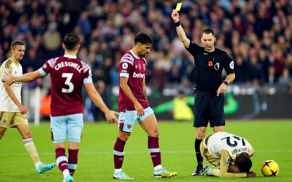 Lucas Paqueta is shown a yellow card