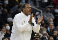 Providence head coach Ed Cooley encourages his team during the first half of an NCAA college basketball game against Butler, Sunday, Jan. 23, 2022, in Providence, R.I. (AP Photo/Mary Schwalm)