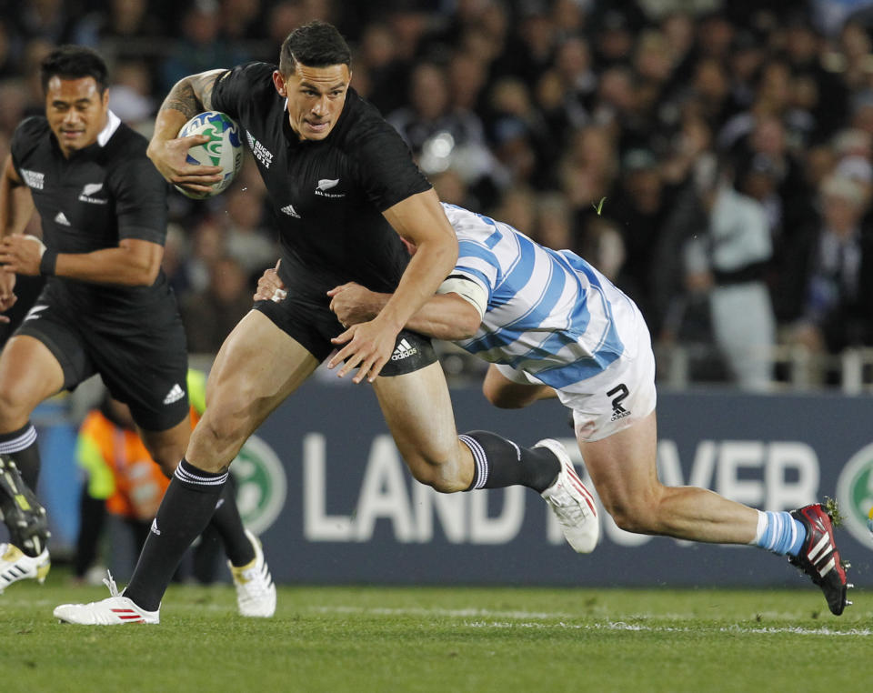 New Zealand All Blacks Sonny Bill Williams is tackled by Argentina's Mario Ledesma Arocena during their Rugby World Cup quarterfinal in Auckland, New Zealand, Sunday, Oct. 9, 2011. (AP Photo/Christophe Ena)