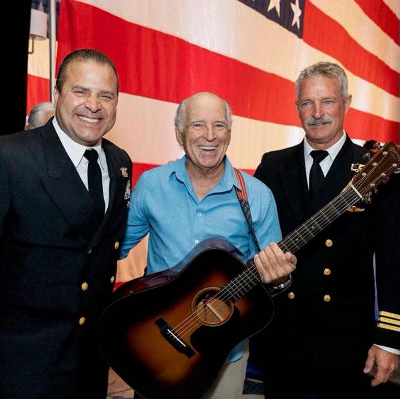 The late Jimmy Buffett, center, with Lt. Cmdr. Hector Delgado (ret.), on left and Cmdr. Grant Mann, (ret.), executive director of the National Navy SEAL Museum, right, at the 2022 Palm Beach Navy SEAL Evening of Tribute at The Breakers. This year's evening is set for April 3 at The Breakers.