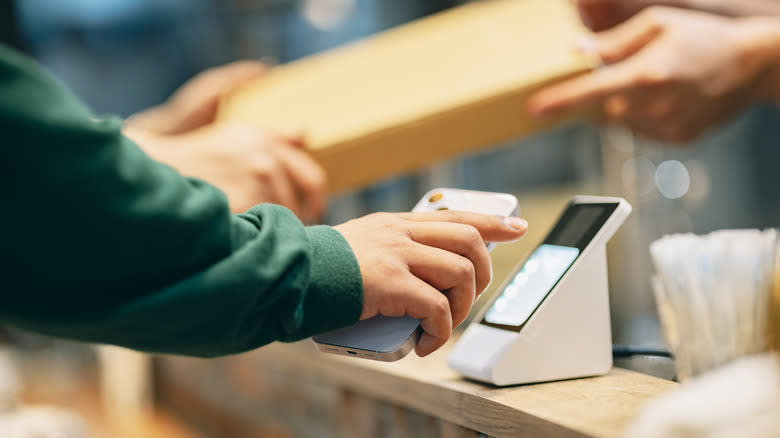 person paying at counter