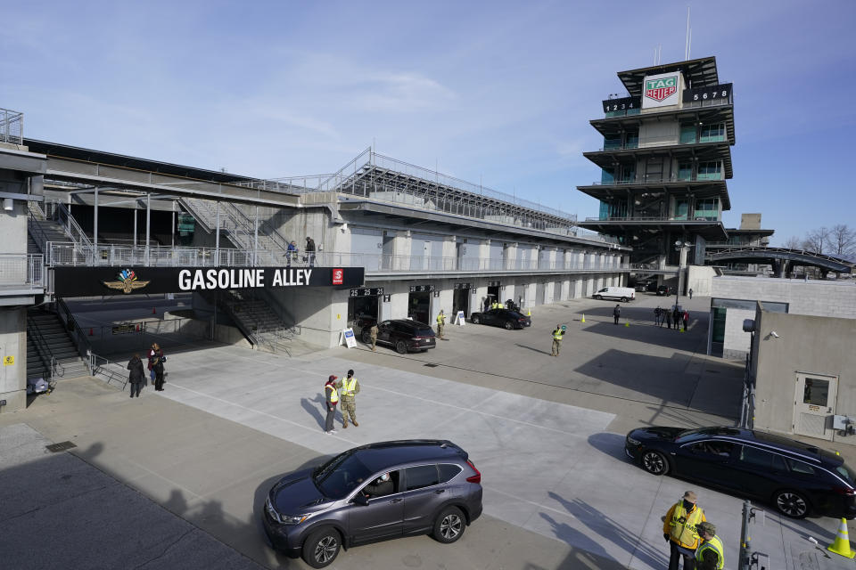 FILE - In this March 5, 2021, file photo, patients arrive to receive the the single-dose Johnson & Johnson COVID-19 vaccine during the state's first mass vaccination clinic at the Indianapolis Motor Speedway in Indianapolis. States across the country are dramatically scaling back their COVID-19 vaccine orders as interest in the shots wanes, putting the goal of herd immunity further out of reach. (AP Photo/Darron Cummings, File)