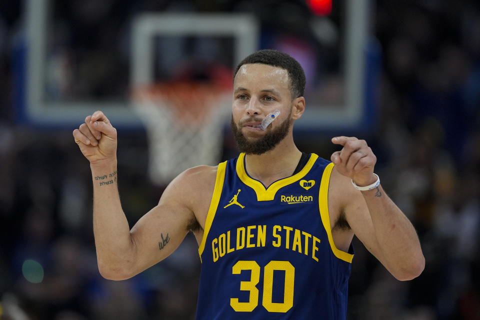 Golden State Warriors guard Stephen Curry reacts during the first half of an NBA basketball game against the Sacramento Kings, Thursday, Jan. 25, 2024, in San Francisco. (AP Photo/Godofredo A. Vásquez)