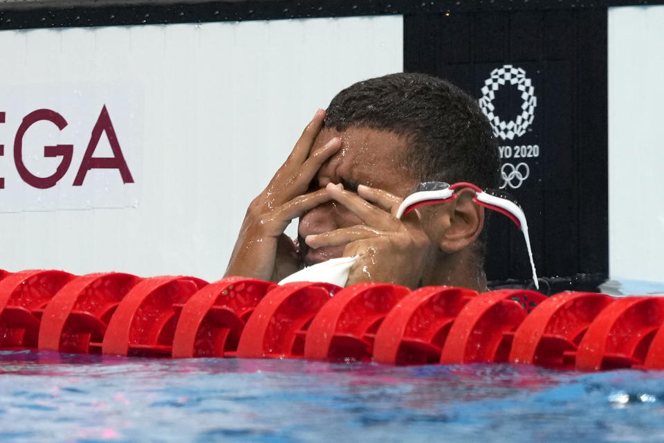 Ahmed Hafnaoui, of Tunisia, reacts after winning the final of the men's 400-meter freestyle at the 2020 Summer Olympics, Sunday, July 25, 2021, in Tokyo, Japan. (AP Photo/Martin Meissner)