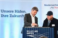 German Economy and Climate Protection Minister Robert Habeck and George Prokopiou of Dynagas sign a contract, in Wilhelmshaven