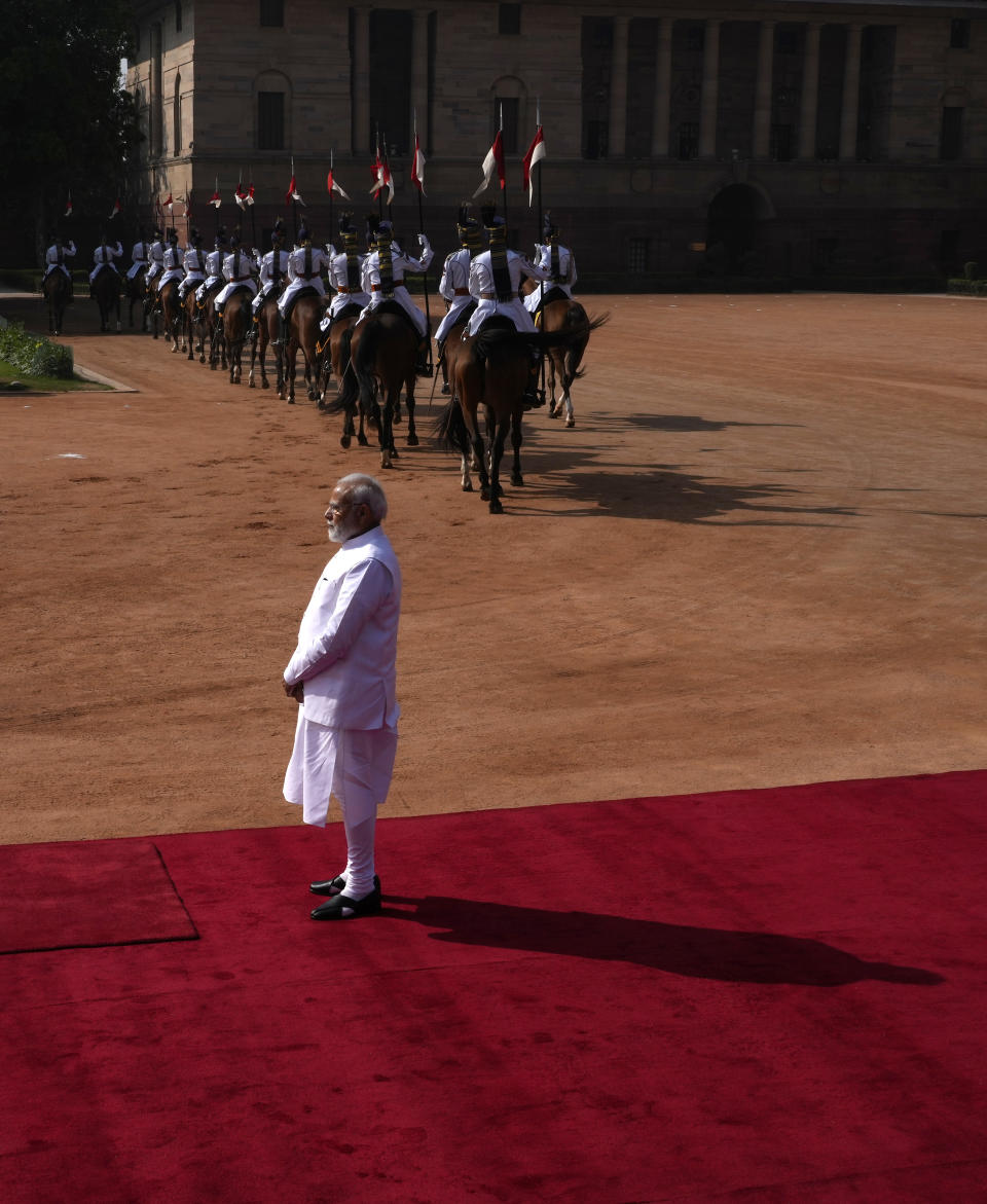 Indian Prime Minister Narendra Modi waits to receive German Chancellor Olaf Scholz for latter's ceremonial reception at the Indian presidential palace, in New Delhi, India, Saturday, Feb. 25, 2023. (AP Photo/Manish Swarup)