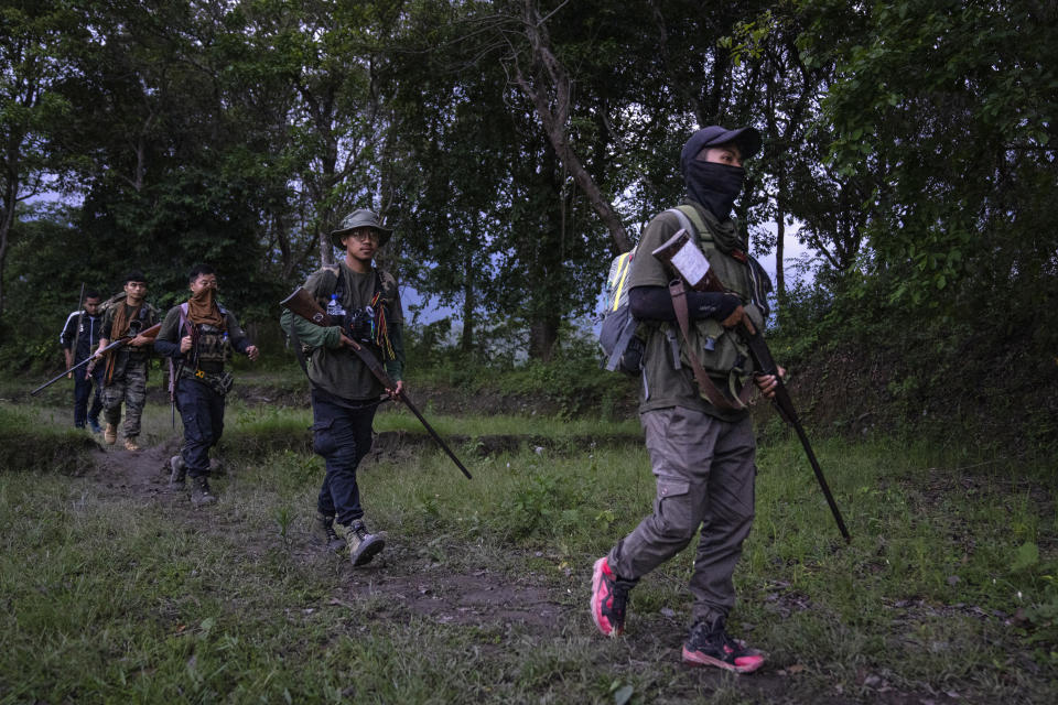 FILE- Armed tribal Kuki community members patrol near a de facto front-line dissecting the area into two ethnic zones in Churachandpur, in Manipur, India, June 20, 2023. For three months, Indian Prime Minister Narendra Modi has been largely silent on ethnic violence that has killed over 150 people in Manipur, a remote state in India’s northeast. That's sparked a no-confidence motion against his government in Parliament, where his party and allies hold a clear majority. (AP Photo/Altaf Qadri, File)