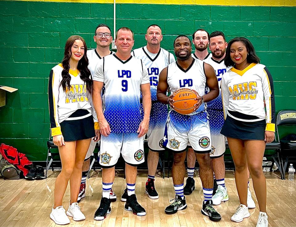 Rondell Seratte, Assistant Chief of Police of the Lawton Police Department, participates with other officers in a local charity basketball game.