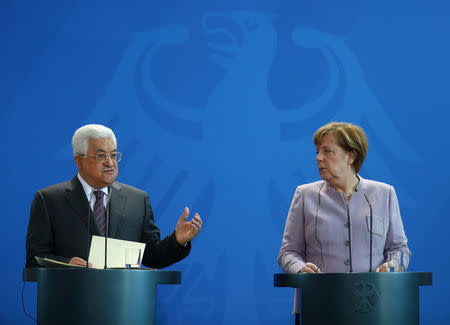 German Chancellor Angela Merkel and Palestinian President Mahmoud Abbas give a statement in Berlin, Germany, March 24, 2017. REUTERS/Pawel Kopczynski