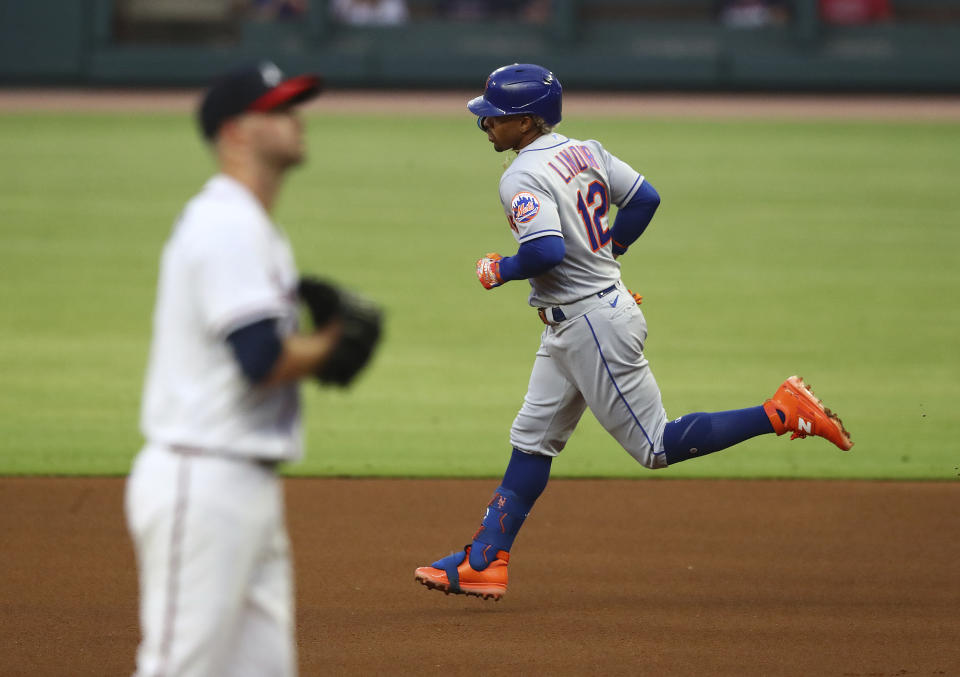 New York Mets' Franciso Lindor runs the bases on his solo home run, past Atlanta Braves starting pitcher Jake Odorizzi during the first inning of a baseball game Wednesday, Aug. 17, 2022, in Atlanta. (Curtis Compton/Atlanta Journal-Constitution via AP)