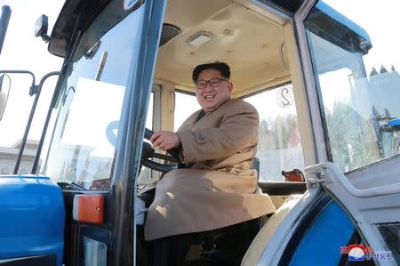 North Korean leader Kim Jong Un gives field guidance to the Kumsong Tractor Factory in this undated picture provided by KCNA in Pyongyang on November 15, 2017. KCNA via Reuters