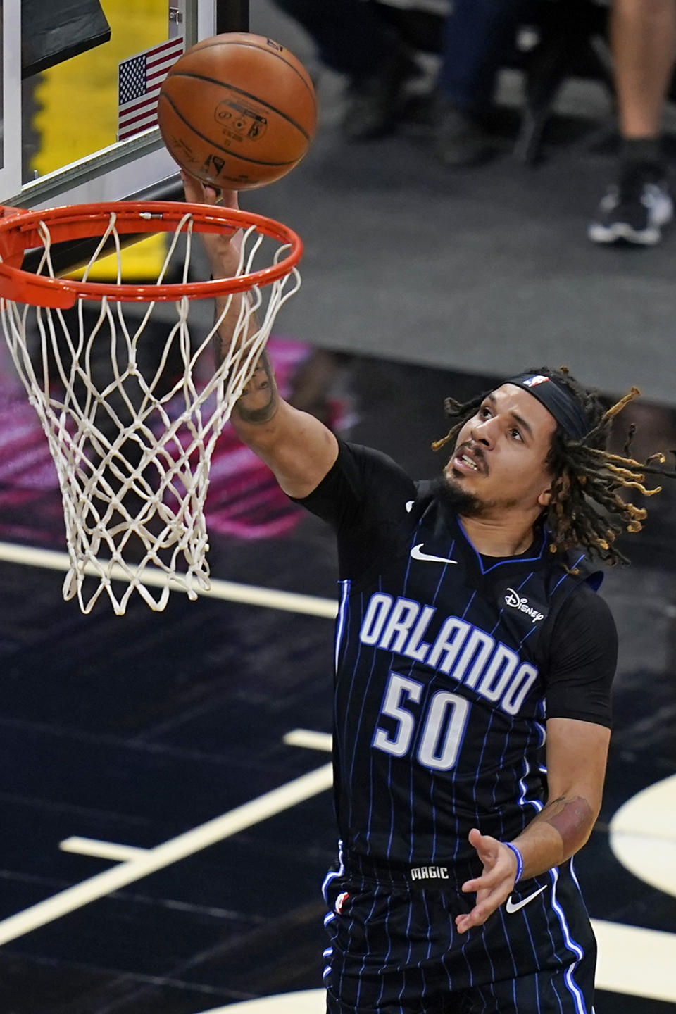 Orlando Magic guard Cole Anthony makes a shot against the Charlotte Hornets during the first half of an NBA basketball game, Monday, Jan. 25, 2021, in Orlando, Fla. (AP Photo/John Raoux)