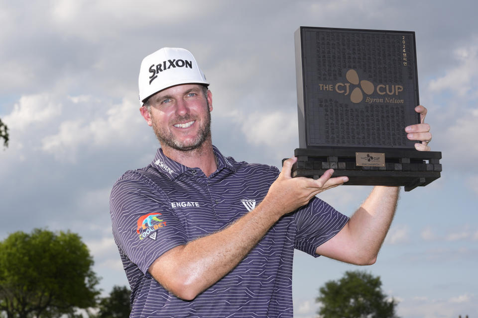 Taylor Pendrith poses with the champion's trophy after winning the Byron Nelson golf tournament in McKinney, Texas, Sunday, May 5, 2024. (AP Photo/LM Otero)