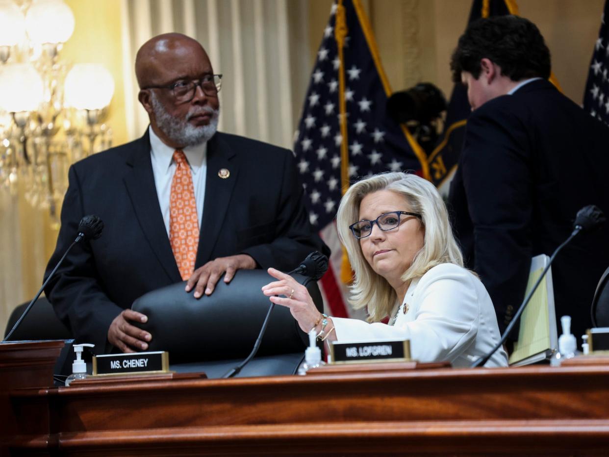 Reps. Liz Cheney and Bennie Thompson take their seats at the start of a January 6 select committee hearing.