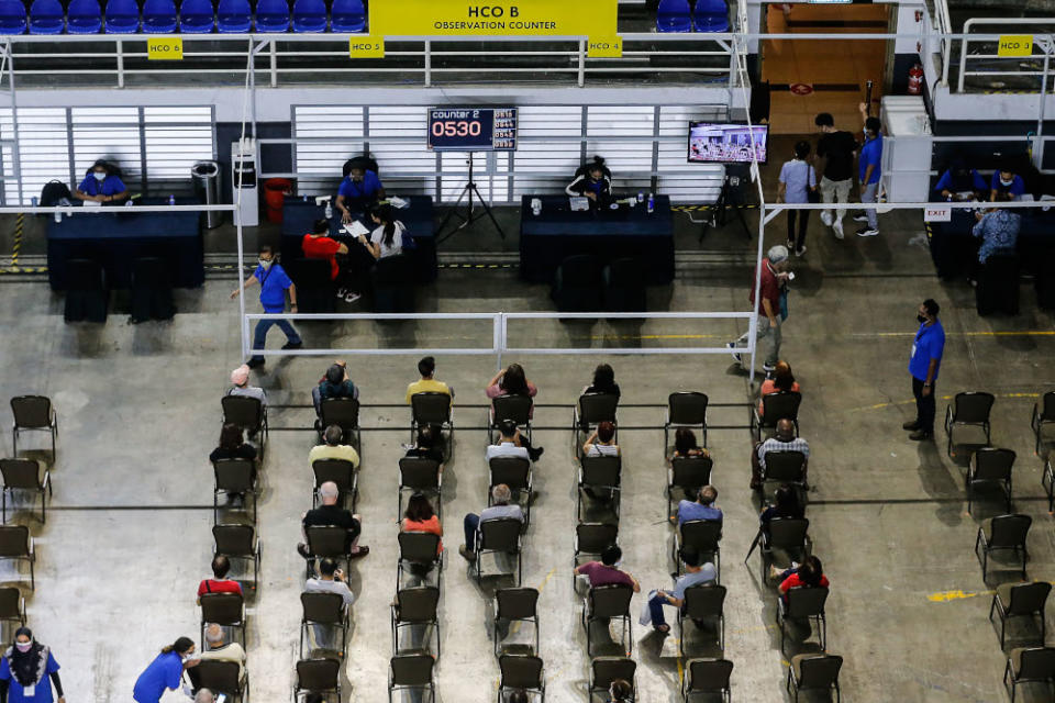 Vaccine recipients wait for their turn at the vaccine distribution centre, SPICE, June 10, 2021. The Sarawak government does not plan to enable walk-in Covid-19 vaccinations in its urban areas, said Deputy Chief Minister Datuk Douglas Uggah June 14, 2021. — Picture by Sayuti Zainudin