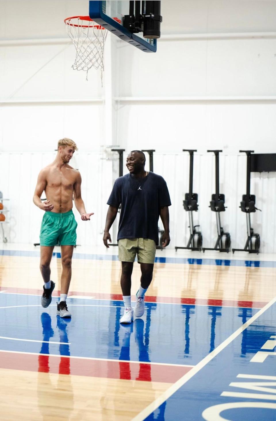 Missouri State guard Kanon Gipson and Rob Yanders walk off the court in the week before Yanders' untimely death at 44 years old. Gipson said the two were laughing because Yanders finally admitted to a foul he committed about 20 minutes prior to the picture.