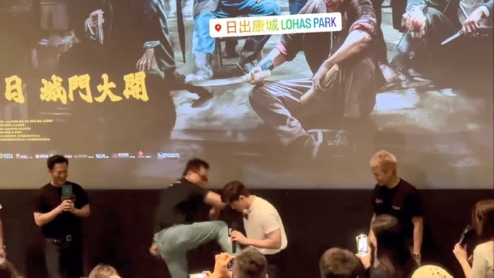 The fan invited on stage decided to kick Philip while he was not ready