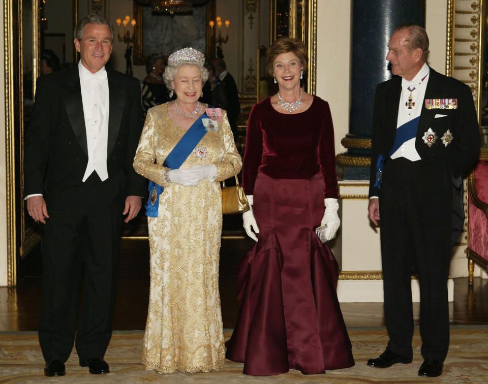 Queen Elizabeth II , U.S. President George W. Bush, First Lady Laura Bush and HRH the Duke of Edinburgh pose in the music room at Buckingham Palace on November 19, 2003 in London.