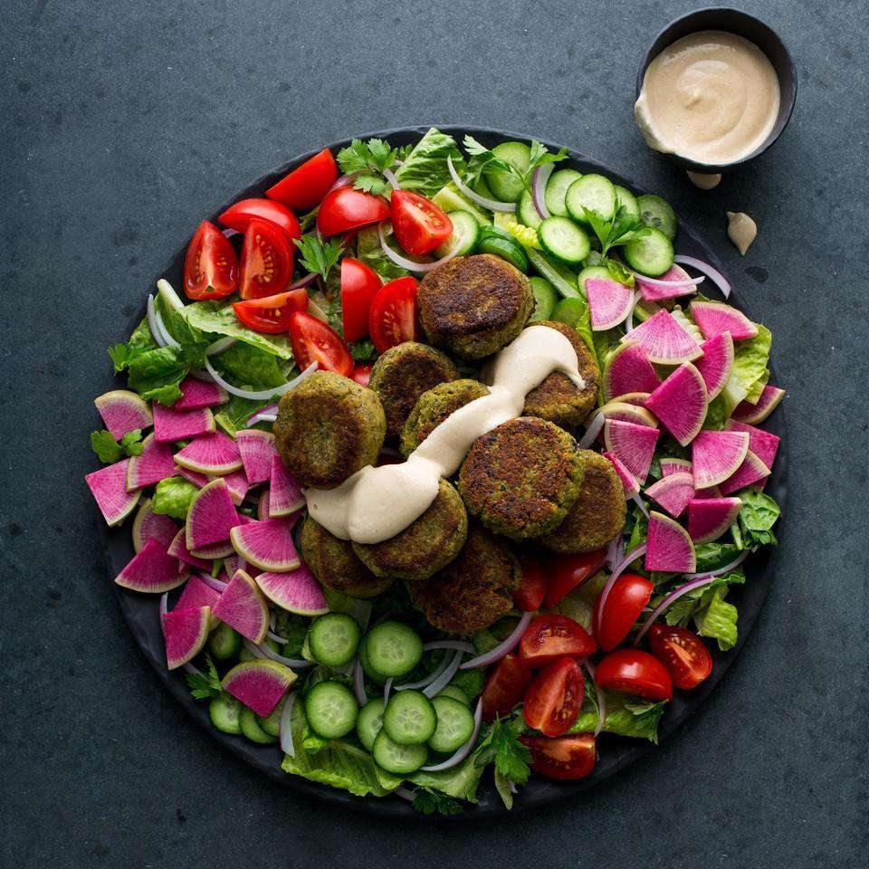 <p>Deep-fried falafel can be a total grease bomb. But these pan-seared falafel still get crispy in just a few tablespoons of oil with equally satisfying results. Be sure to use dried, instead of canned, chickpeas in this healthy recipe—canned chickpeas add too much moisture.</p> <p> <a href="https://www.eatingwell.com/recipe/253015/falafel-salad-with-lemon-tahini-dressing/" rel="nofollow noopener" target="_blank" data-ylk="slk:View Recipe;elm:context_link;itc:0;sec:content-canvas" class="link ">View Recipe</a></p>