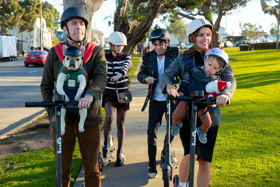 Family Switch - (L to R) Ed Helms as Bill, Emma Myers as CC, Brady Noon as Wyatt, Jennifer Garner as Jess, and Lincoln Alex Sykes and Theodore Brian Sykes as Baby Miles, in Family Switch. Cr. Colleen Hayes/Netflix © 2023.