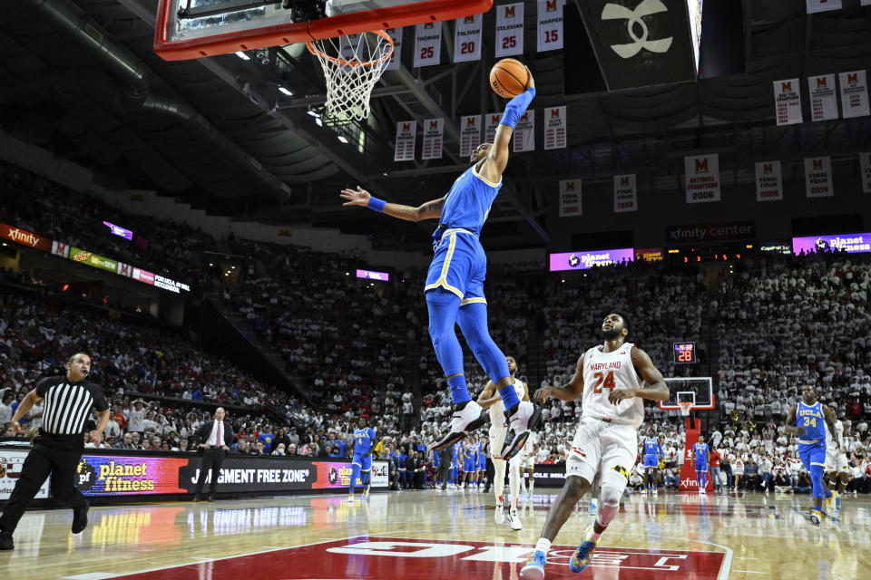 UCLA guard Amari Bailey goes to the basket for a dunk during the first half of an NCAA college basketball game against Maryland, Wednesday, Dec. 14, 2022, in College Park, Md. (AP Photo/Terrance Williams)