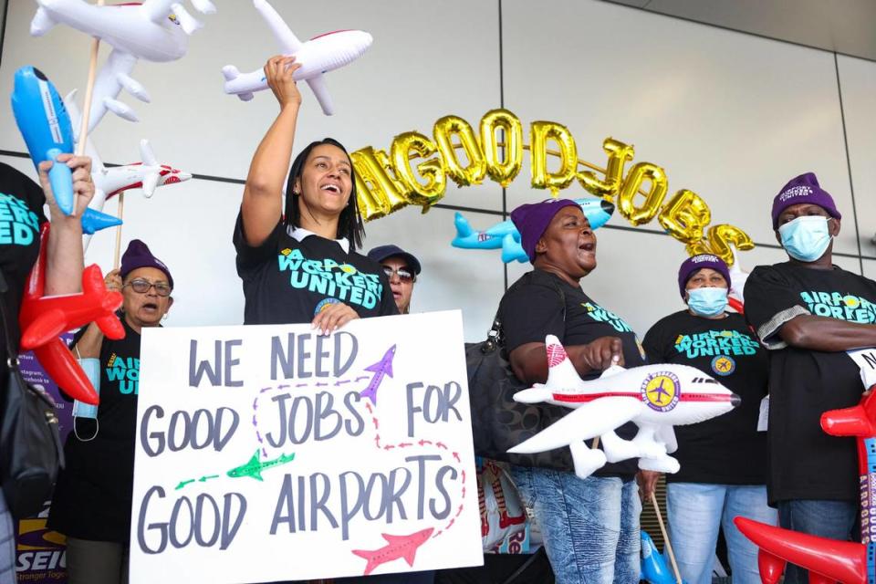Leila Benitez, union crew chief, left, chants during a protest of contracted airport workers demanding better wages, paid sick leave, and other benefits on Thursday, Dec. 8, 2022, at the Miami International Airport. Contracted workers like these would be affected by legislation under consideration in Tallahassee that would end local city and county governments’ ”living wage” ordinances.