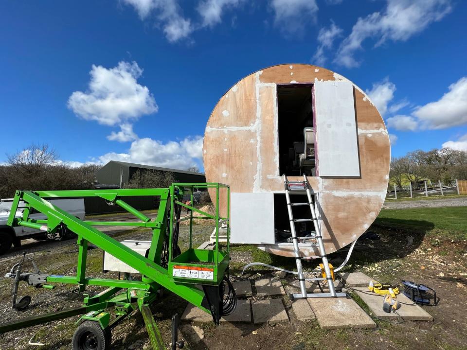 Cherry-picker used to paint plane