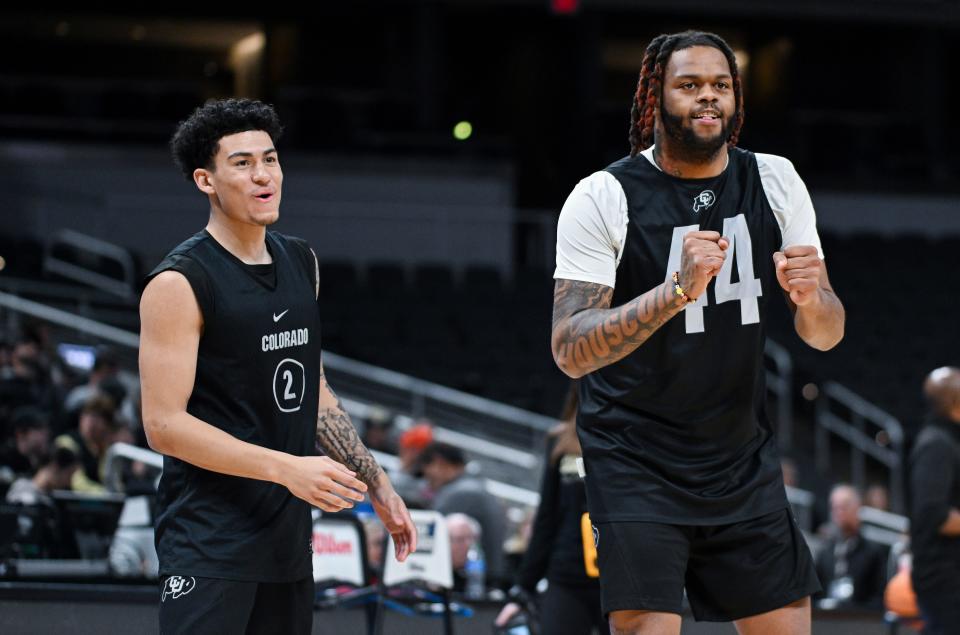 Mar 21, 2024; Indianapolis, IN, USA; Colorado Buffaloes guard KJ Simpson (2) and center Eddie Lampkin Jr. (44) smile during the NCAA tournament practice day at Gainbridge FieldHouse.