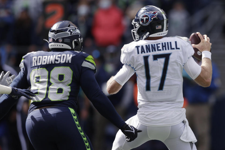 Seattle Seahawks defensive end Alton Robinson (98) moves to hit Tennessee Titans quarterback Ryan Tannehill for a fumble that was recovered by the Seahawks during the first half of an NFL football game, Sunday, Sept. 19, 2021, in Seattle. (AP Photo/John Froschauer)