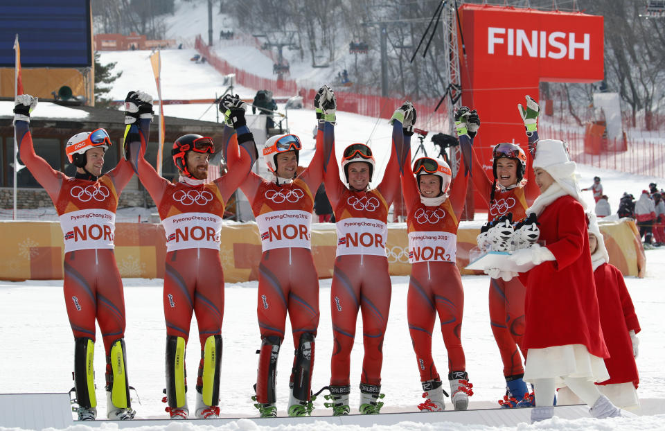 Team Norway celebrates taking the bronze medal in the alpine team event during the venue ceremony at the 2018 Winter Olympics in Pyeongchang, South Korea, Saturday, Feb. 24, 2018. (AP Photo/Christophe Ena)