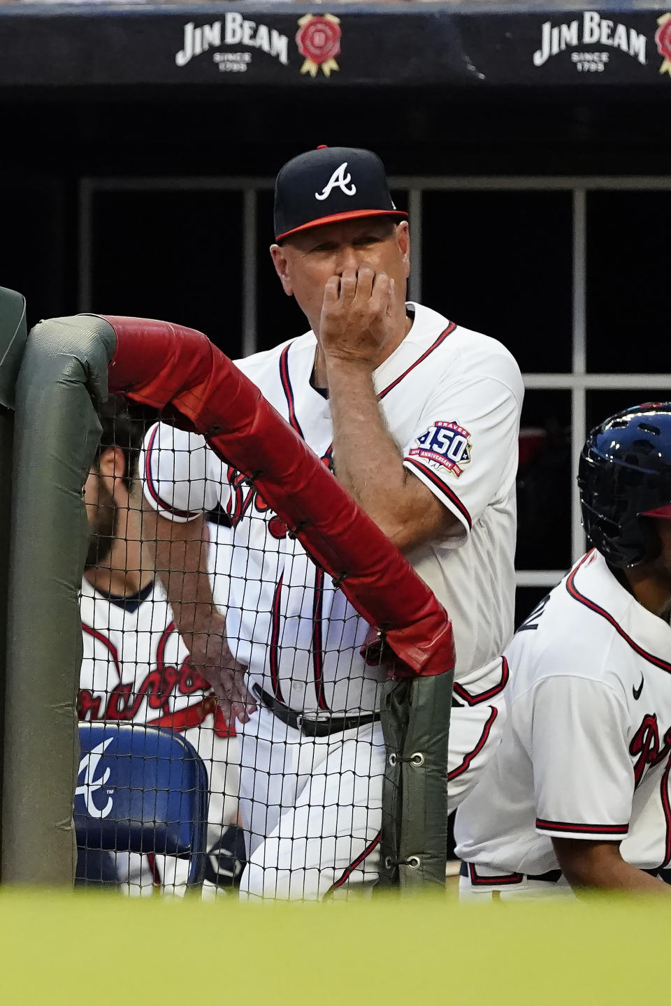 Atlanta Braves manager Brian Snitker watches from the dugout during a baseball game against the Tampa Bay Rays, Saturday, July 17, 2021, in Atlanta. (AP Photo/John Bazemore)