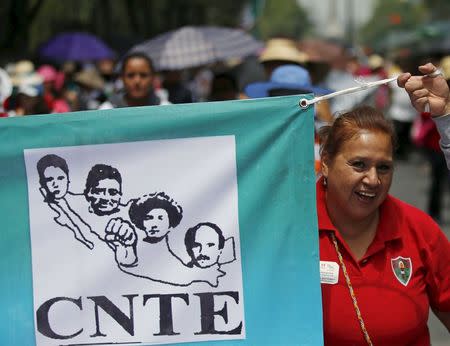 Members of the teacher's union CNTE carry a banner during a march along Reforma Avenue in Mexico City June 1, 2015. REUTERS/Henry Romero