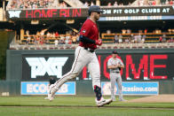 Minnesota Twins' Mitch Garver jogs home on a grand slam off Detroit Tigers pitcher Tyler Alexander, rear, durng the first inning of a baseball game Tuesday, July 27, 2021, in Minneapolis. (AP Photo/Jim Mone)