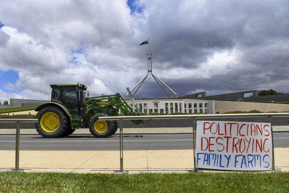 Some farmers rode their tractors to Parliament House in Canberra for the ‘Can the Murray-Darling Basin Plan’ rally on Monday, December 2, 2019. <a href="https://photos.aap.com.au/search/canberra%20farmers%20protest" rel="nofollow noopener" target="_blank" data-ylk="slk:LUKAS COCH/AAP;elm:context_link;itc:0;sec:content-canvas" class="link ">LUKAS COCH/AAP</a>