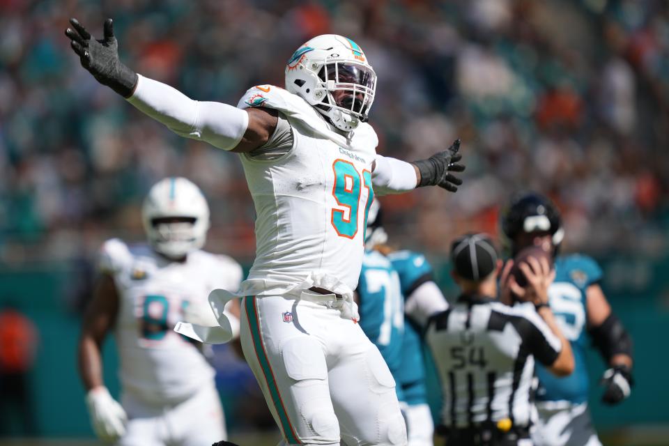 Miami Dolphins defensive end Emmanuel Ogbah (9) celebrates a sack of Jaguars quarterback Trevor Lawrence. JIM RASSOL/Imagn Images