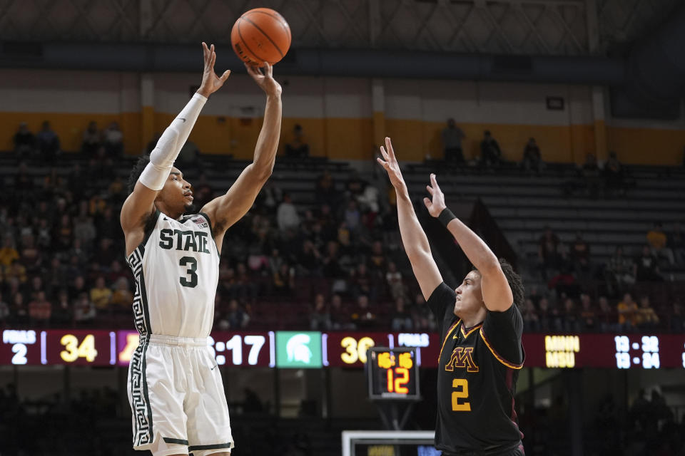 Michigan State guard Jaden Akins (3) shoots over Minnesota guard Mike Mitchell Jr. (2) during the second half of an NCAA college basketball game Tuesday, Feb. 6, 2024, in Minneapolis. (AP Photo/Abbie Parr)